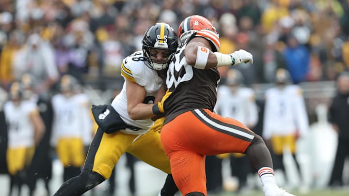 Dec 28, 2025; Cleveland, Ohio, USA; Pittsburgh Steelers tight end Pat Freiermuth (88) blocks Cleveland Browns defensive end Myles Garrett (95) in the second quarter at Huntington Bank Field. Mandatory Credit: Scott Galvin-Imagn Images