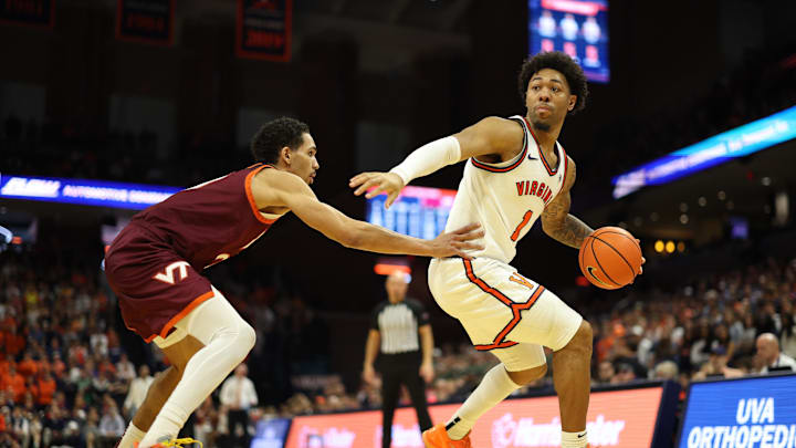 Mar 7, 2026; Charlottesville, Virginia, USA; Virginia Cavaliers guard Malik Thomas (1) dribbles the ball as Virginia Tech Hokies guard Jailen Bedford (0) defends in the second half at John Paul Jones Arena. Mandatory Credit: Geoff Burke-Imagn Images