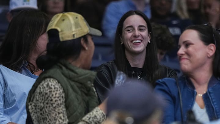Indiana Fever Caitlin Clark smiles while talking to Butler Bulldogs fans on Monday, Nov. 4, 2024, during the game at Hinkle Fieldhouse in Indianapolis. The Butler Bulldogs defeated the Missouri State Bears, 72-65.