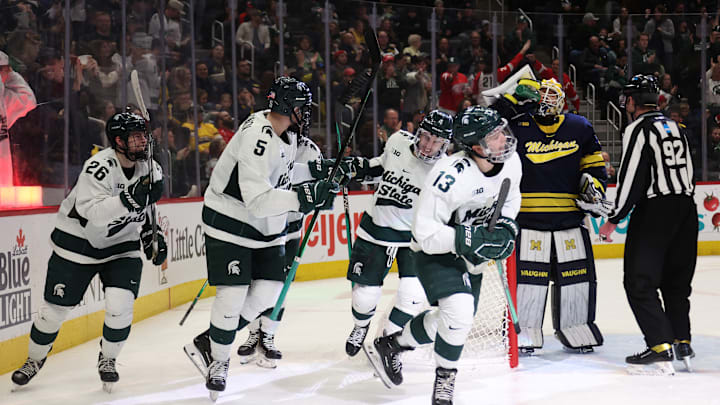 The  Spartans celebrate a goal scored by sophomore forward Tiernan Shoudy.