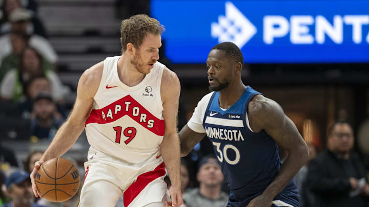 Toronto Raptors center Jakob Poeltl (19) backs towards the basket as Minnesota Timberwolves forward Julius Randle plays defense in the first half at Target Center in Minneapolis on Oct. 26, 2024. Toronto Raptors center Jakob Poeltl (19) backs towards the basket as Minnesota Timberwolves forward Julius Randle plays defense in the first half at Target Center in Minneapolis on Oct. 26, 2024.