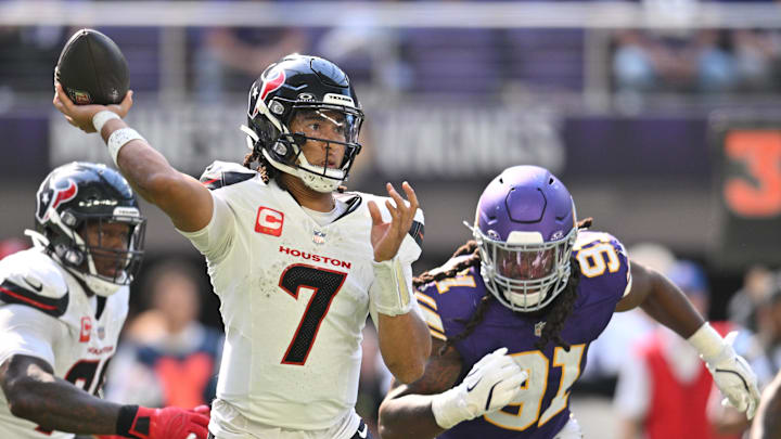 Sep 22, 2024; Minneapolis, Minnesota, USA; Houston Texans quarterback C.J. Stroud (7) throws a pass as Minnesota Vikings linebacker Pat Jones II (91) pursues during the third quarter at U.S. Bank Stadium. Mandatory Credit: Jeffrey Becker-Imagn Images