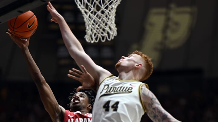 Alabama Crimson Tide forward Derrion Reid (35) shoots the ball in front of Purdue Boilermakers center Will Berg (44) 