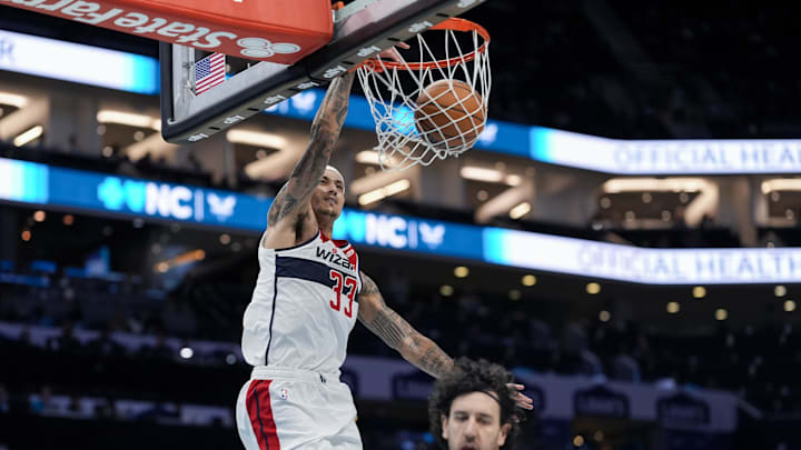 Feb 3, 2025; Charlotte, North Carolina, USA; Washington Wizards forward Kyle Kuzma (33) with a dunk against the Charlotte Hornets during the second half at Spectrum Center. Mandatory Credit: Jim Dedmon-Imagn Images. Feb 3, 2025; Charlotte, North Carolina, USA; Washington Wizards forward Kyle Kuzma (33) with a dunk against the Charlotte Hornets during the second half at Spectrum Center. Mandatory Credit: Jim Dedmon-Imagn Images.