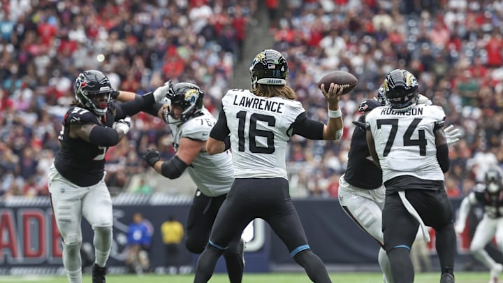 Sep 29, 2024; Houston, Texas, USA; Jacksonville Jaguars quarterback Trevor Lawrence (16) attempts a pass during the fourth quarter against the Houston Texans at NRG Stadium. Mandatory Credit: Troy Taormina-Imagn Images