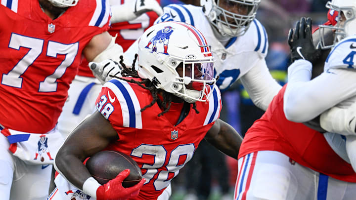 Dec 1, 2024; Foxborough, Massachusetts, USA; New England Patriots running back Rhamondre Stevenson (38) runs the ball against the Indianapolis Colts during the second half at Gillette Stadium. Mandatory Credit: Eric Canha-Imagn Images