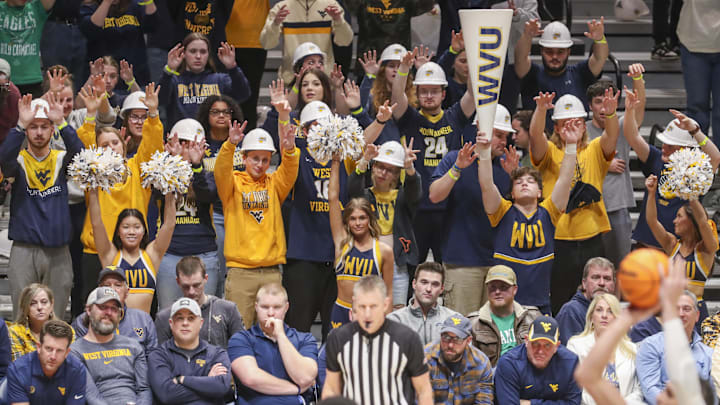 Mar 2, 2024; Morgantown, West Virginia, USA; West Virginia Mountaineers students pause during a foul shot during the first half against the Texas Tech Red Raiders at WVU Coliseum. Mandatory Credit: Ben Queen-Imagn Images