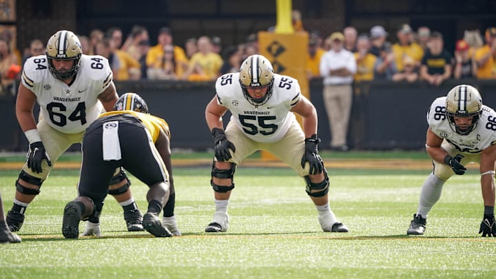 Oct 22, 2022; Columbia, Missouri, USA; Vanderbilt Commodores offensive lineman Delfin Xavier Castillo (64) and offensive lineman Gunnar Hansen (55) and tight end Ben Bresnahan (86) on the line of scrimmage against the Missouri Tigers during the game at Faurot Field at Memorial Stadium. Mandatory Credit: Denny Medley-Imagn Images