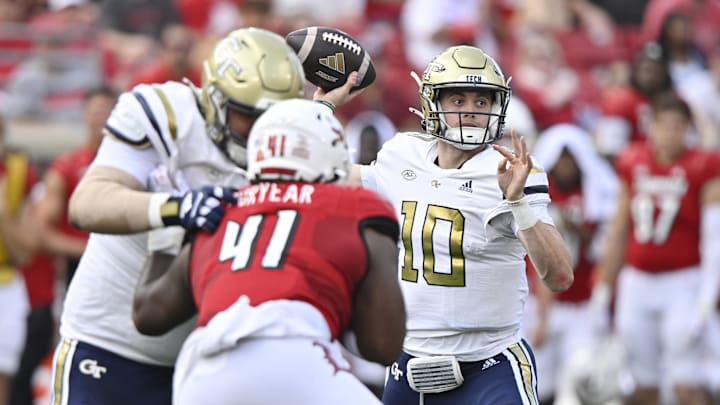 Sep 21, 2024; Louisville, Kentucky, USA;  Georgia Tech Yellow Jackets quarterback Haynes King (10) looks to pass the ball against the Louisville Cardinals during the first quarter at L&N Federal Credit Union Stadium. Mandatory Credit: Jamie Rhodes-Imagn Images