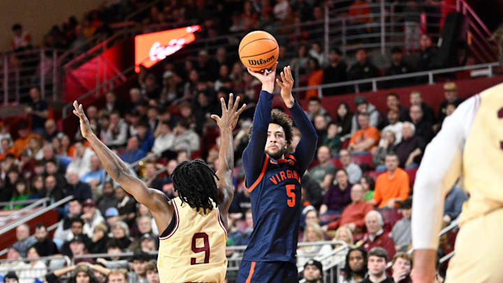 Jan 31, 2026; Chestnut Hill, Massachusetts, USA; Virginia Cavaliers guard Sam Lewis (5) shoots over Boston College Eagles guard Chase Forte (9) during the second half at Conte Forum. Mandatory Credit: Eric Canha-Imagn Images