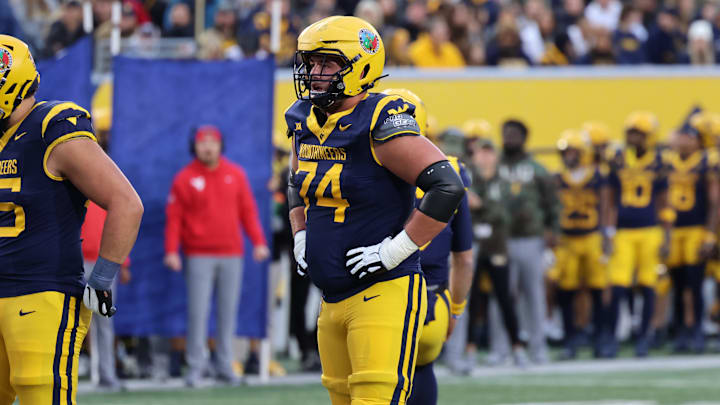 West Virginia University offensive lineman Wyatt Milum (74).