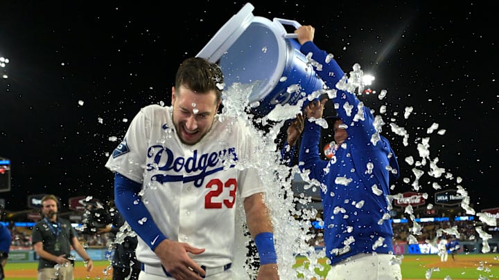 Apr 27, 2026; Los Angeles, California, USA; Los Angeles Dodgers right fielder Kyle Tucker (23) gets doused with a cooler of ice water by right fielder Alex Call (12) after hitting a walk-off single to defeat the Miami Marlins in the ninth inning at Dodger Stadium. Mandatory Credit: Jayne Kamin-Oncea-Imagn Images