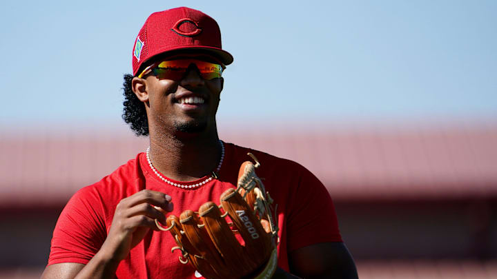 Cincinnati Reds infielder Jose Barrero (2) smiles during long toss drills.