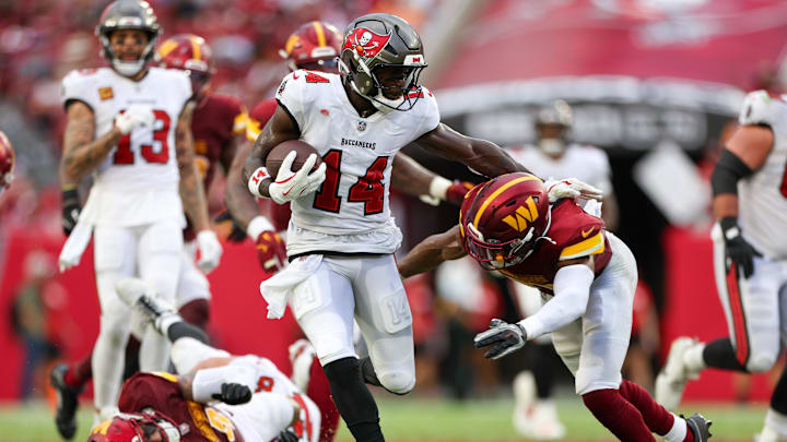 Sep 8, 2024; Tampa, Florida, USA; Tampa Bay Buccaneers wide receiver Chris Godwin (14) runs with the ball against the Washington Commanders in the fourth quarter at Raymond James Stadium. Mandatory Credit: Nathan Ray Seebeck-Imagn Images Sep 8, 2024; Tampa, Florida, USA; Tampa Bay Buccaneers wide receiver Chris Godwin (14) runs with the ball against the Washington Commanders in the fourth quarter at Raymond James Stadium. Mandatory Credit: Nathan Ray Seebeck-Imagn Images
