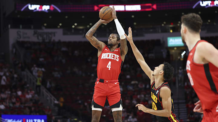 Mar 25, 2025; Houston, Texas, USA; Houston Rockets guard Jalen Green (4) shoots the ball as Atlanta Hawks forward Zaccharie Risacher (10) defends during the first quarter at Toyota Center. Mandatory Credit: Troy Taormina-Imagn Images