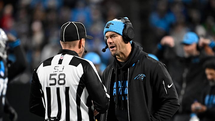 Dec 1, 2024; Charlotte, North Carolina, USA; Carolina Panthers head coach Dave Canales talks to the official in the fourth quarter at Bank of America Stadium. Mandatory Credit: Bob Donnan-Imagn Images