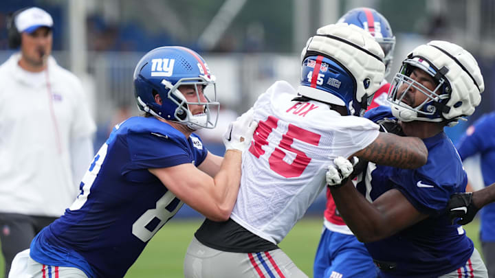 Jul 25, 2024; East Rutherford, NY, USA; New York Giants tight end Jack Stoll (89) blocks linebacker Tomon Fox (45)  during training camp at Quest Diagnostics Training Center.  