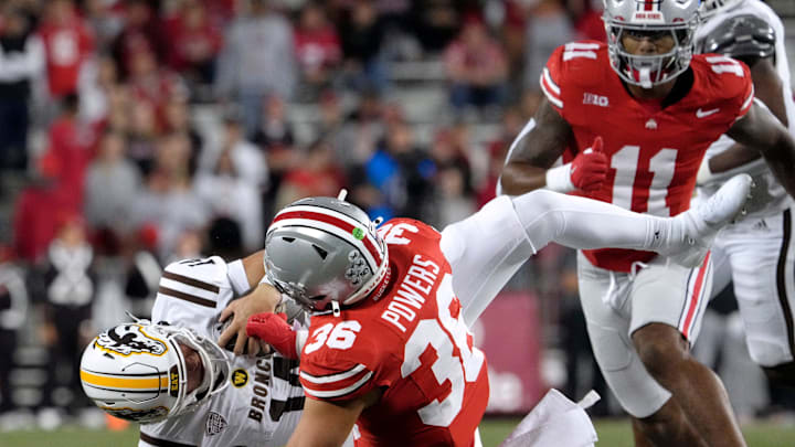 Sept. 7, 2024; Columbus, Ohio, USA;
Western Michigan Broncos quarterback Broc Lowry (14) is tackled by Ohio State Buckeyes linebacker Gabe Powers (36) during the second half of an NCAA Division I football game on Saturday at Ohio Stadium.