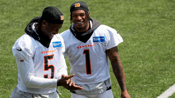 Cincinnati Bengals wide receiver Tee Higgins (5) and wide receiver Ja'Marr Chase (1) talks not he sideline during an off-season workout inside Paycor Stadium in downtown Cincinnati on Tuesday, June 13, 2023. Cincinnati Bengals wide receiver Tee Higgins (5) and wide receiver Ja'Marr Chase (1) talks not he sideline during an off-season workout inside Paycor Stadium in downtown Cincinnati on Tuesday, June 13, 2023.