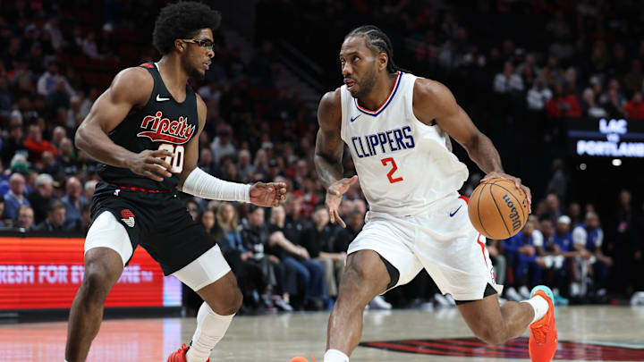 LA Clippers forward Kawhi Leonard (2) dribbles the ball against Portland Trail Blazers guard Scoot Henderson (00) in the first quarter at Moda Center. Mandatory Credit: Jaime Valdez-Imagn Images