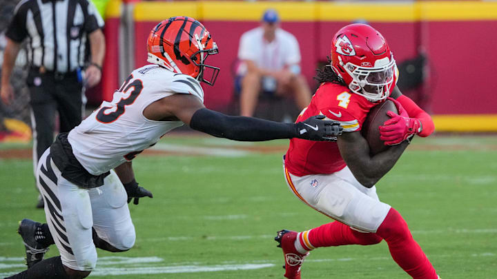 Sep 15, 2024; Kansas City, Missouri, USA; Kansas City Chiefs wide receiver Rashee Rice (4) runs the ball as Cincinnati Bengals cornerback Dax Hill (23) attempts the tackle during the game at GEHA Field at Arrowhead Stadium. Mandatory Credit: Denny Medley-Imagn Images