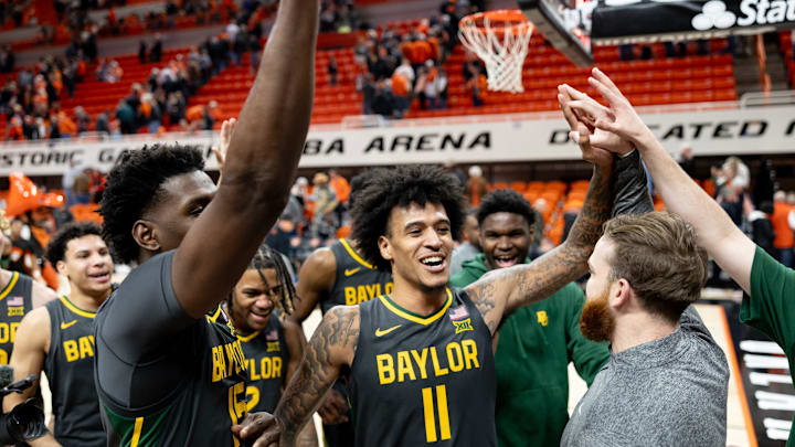 Jan 6, 2024; Stillwater, Okla, USA; Baylor Bears forward Jalen Bridges (11) and forward Josh Ojianwuna (15) celebrate with team mates after an NCAA men s basketball game against the Oklahoma State Cowboys at Gallagher-Iba arena. Mandatory Credit: Mitch Alcala-The Oklahoman Jan 6, 2024; Stillwater, Okla, USA; Baylor Bears forward Jalen Bridges (11) and forward Josh Ojianwuna (15) celebrate with team mates after an NCAA men s basketball game against the Oklahoma State Cowboys at Gallagher-Iba arena. Mandatory Credit: Mitch Alcala-The Oklahoman