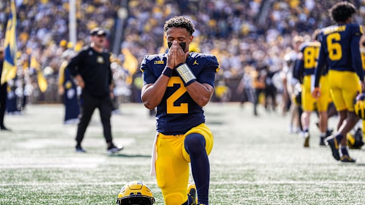Michigan quarterback Jadyn Davis (2) prays before kickoff between Michigan and Washington at Michigan Stadium in Ann Arbor on Saturday, Oct. 18, 2025. Michigan quarterback Jadyn Davis (2) prays before kickoff between Michigan and Washington at Michigan Stadium in Ann Arbor on Saturday, Oct. 18, 2025.