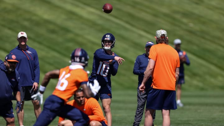 May 23, 2024; Englewood, CO, USA; Denver Broncos quarterback Bo Nix (10) passes to wide receiver Troy Franklin (16) during organized team activities at Centura Health Training Center. Mandatory Credit: Isaiah J. Downing-USA TODAY Sports