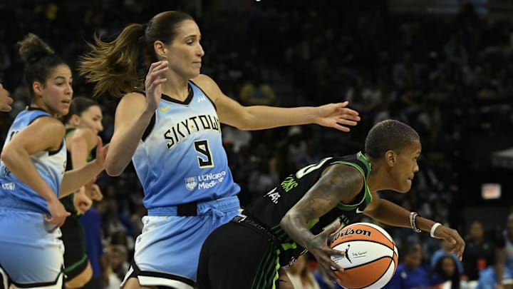 Jul 14, 2025; Chicago, Illinois, USA;  Minnesota Lynx guard Courtney Williams (10) moves the ball against Chicago Sky guard Rebecca Allen (9) during the second half at Wintrust Arena. Mandatory Credit: Matt Marton-Imagn Images