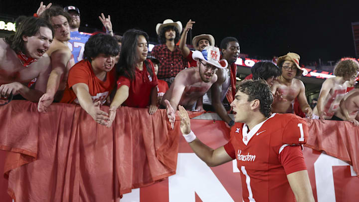 Aug 28, 2025; Houston, Texas, USA; Houston Cougars quarterback Conner Weigman (1) celebrates with fans after the game against the Stephen F. Austin Lumberjacks at TDECU Stadium. Mandatory Credit: Troy Taormina-Imagn Images