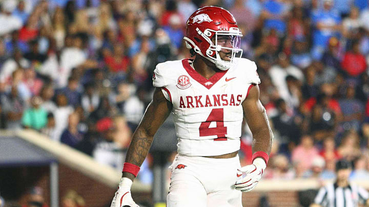 Sep 13, 2025; Oxford, Mississippi, USA; Arkansas Razorback running back Mike Washington Jr. (4) reacts after a touchdown during the fourth quarter against the Mississippi Rebels at Vaught-Hemingway Stadium. Mandatory Credit: Petre Thomas-Imagn Images