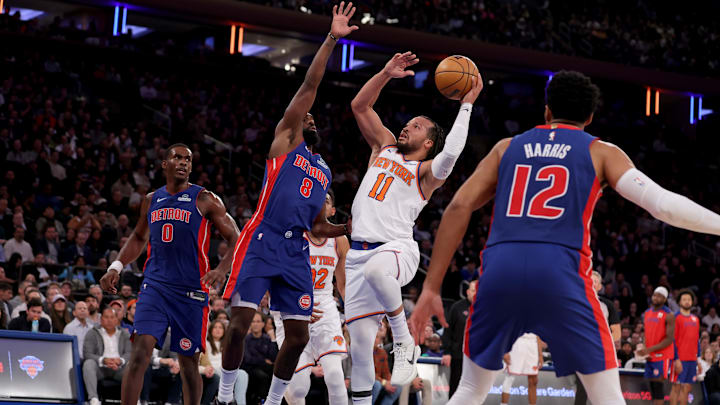 Jan 13, 2025; New York, New York, USA; New York Knicks guard Jalen Brunson (11) drives to the basket against Detroit Pistons forward Tim Hardaway Jr. (8) and center Jalen Duren (0) and forward Tobias Harris (12) during the second quarter at Madison Square Garden. Mandatory Credit: Brad Penner-Imagn Images