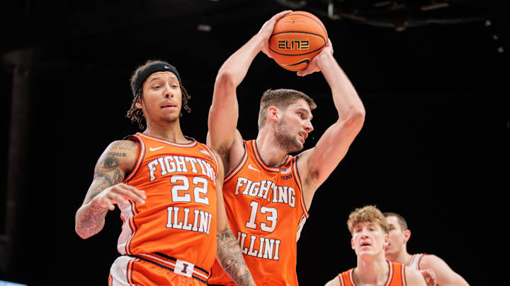 Nov 28, 2024; Kansas City, Missouri, USA; Illinois Fighting Illini center Tomislav Ivisic (13) rebound during the first half against the Arkansas Razorbacks at T-Mobile Center. Mandatory Credit: William Purnell-Imagn Images