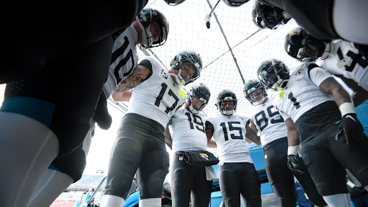 Dec 8, 2024; Nashville, Tennessee, USA;  Jacksonville Jaguars quarterback Mac Jones (10) and tight end Evan Engram (17) huddle with teammates as they take the field against the Tennessee Titans during the first half at Nissan Stadium. Mandatory Credit: Steve Roberts-Imagn Images