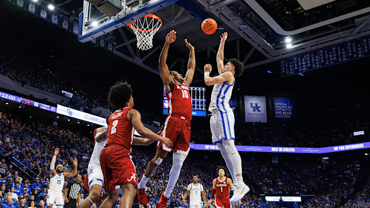Jan 18, 2025; Lexington, Kentucky, USA; Kentucky Wildcats guard Koby Brea (4) shoots the ball over Alabama Crimson Tide forward Mouhamed Dioubate (10) during the second half at Rupp Arena at Central Bank Center. Mandatory Credit: Jordan Prather-Imagn Images