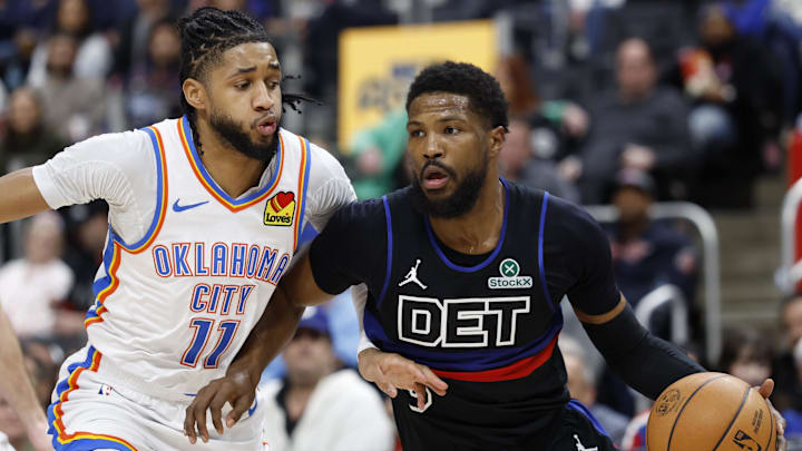Mar 15, 2025; Detroit, Michigan, USA;  Detroit Pistons guard Malik Beasley (5) dribbles on Oklahoma City Thunder guard Isaiah Joe (11) in the first half at Little Caesars Arena. Mandatory Credit: Rick Osentoski-Imagn Images
