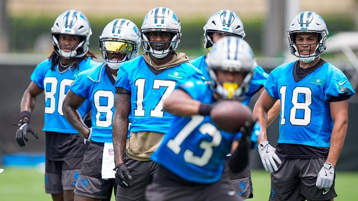 Jun 9, 2026; Charlotte, NC, USA;  Wide receivers Xavier Legette, Jalen Coker, David Moore and Ja'seem Reed watch wide receiver John Metchie III (13) make a catch during the first day of mini camp at Bank of America Stadium practice facility. Mandatory Credit: Jim Dedmon-Imagn Images
