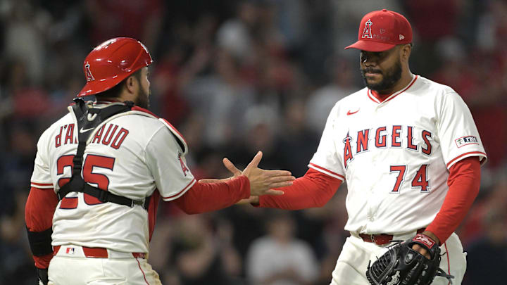 Jun 9, 2025; Anaheim, California, USA;   Los Angeles Angels relief pitcher Kenley Jansen (74) shakes hands with catcher Travis d'Arnaud (25) after his 15th save of the season in the ninth inning against the Athletics at Angel Stadium. Mandatory Credit: Jayne Kamin-Oncea-Imagn Images