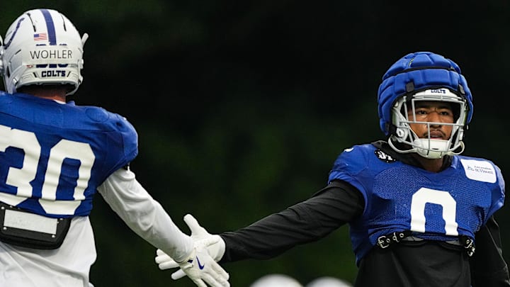 Indianapolis Colts safety Camryn Bynum (0) high-fives Indianapolis Colts safety Hunter Wohler (30) on Thursday, July 31, 2025, during Colts Training Camp at Grand Park in Westfield.