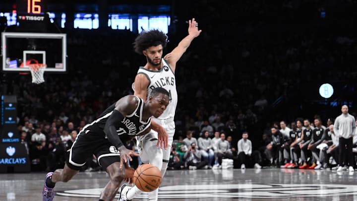Dec 8, 2024; Brooklyn, New York, USA; Brooklyn Nets guard Dennis Schroder (17) brings the ball up court while being defended by Milwaukee Bucks guard Andre Jackson Jr. (44) during the first half at Barclays Center. Mandatory Credit: John Jones-Imagn Images