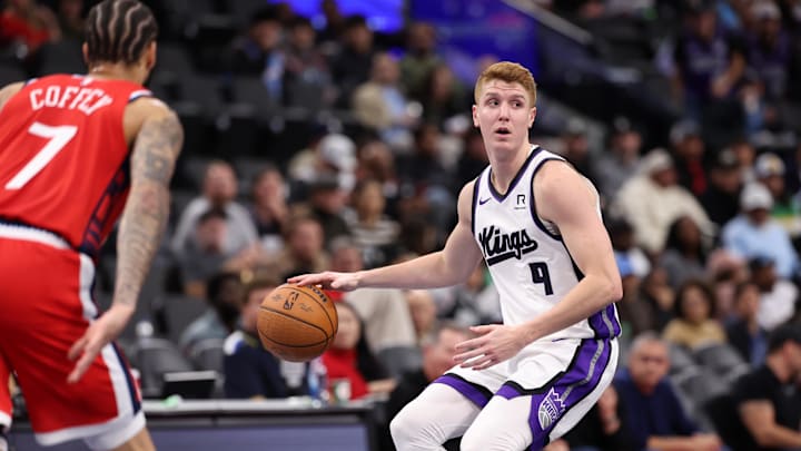 Nov 22, 2024; Inglewood, California, USA;  Sacramento Kings guard Kevin Huerter (9) looks to pass against Los Angeles Clippers guard Amir Coffey (7) during the third quarter at Intuit Dome. Mandatory Credit: Kiyoshi Mio-Imagn Images