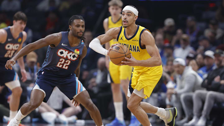 Jan 23, 2026; Oklahoma City, Oklahoma, USA; Indiana Pacers guard/forward Andrew Nembhard (2) passes beside Oklahoma City Thunder guard Cason Wallace (22) during the second quarter at Paycom Center. Mandatory Credit: Alonzo Adams-Imagn Images