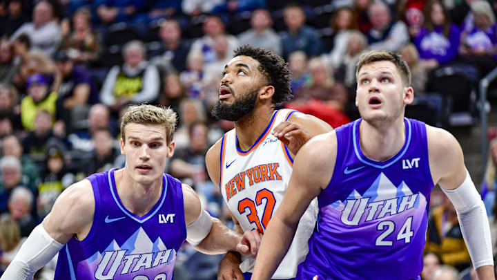 Nov 23, 2024; Salt Lake City, Utah, USA; Utah Jazz forward/center Lauri Markkanen (23) and center Walker Kessler (24) battle for position against New York Knicks center/forward Karl-Anthony Towns (32) during a free-throw during the first half at the Delta Center. Mandatory Credit: Christopher Creveling-Imagn Images