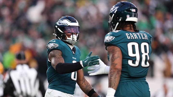 Jan 12, 2025; Philadelphia, Pennsylvania, USA; Philadelphia Eagles safety C.J. Gardner-Johnson (8) and defensive tackle Jalen Carter (98) shake hands after a stop against the Green Bay Packers in an NFC wild card game at Lincoln Financial Field. Mandatory Credit: Bill Streicher-Imagn Images