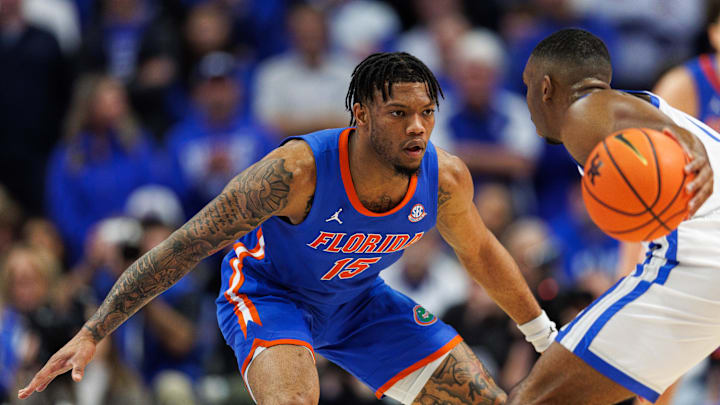 Jan 4, 2025; Lexington, Kentucky, USA; Florida Gators guard Alijah Martin (15) defends against Kentucky Wildcats guard Lamont Butler (1) during the first half at Rupp Arena at Central Bank Center. Mandatory Credit: Jordan Prather-Imagn Images
