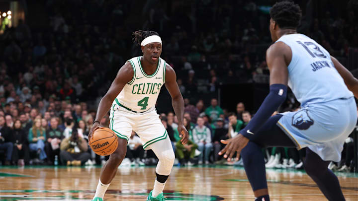 Dec 7, 2024; Boston, Massachusetts, USA; Boston Celtics guard Jrue Holiday (4) dribbles down the court during the first half against the Memphis Grizzlies at TD Garden. Mandatory Credit: Paul Rutherford-Imagn Images