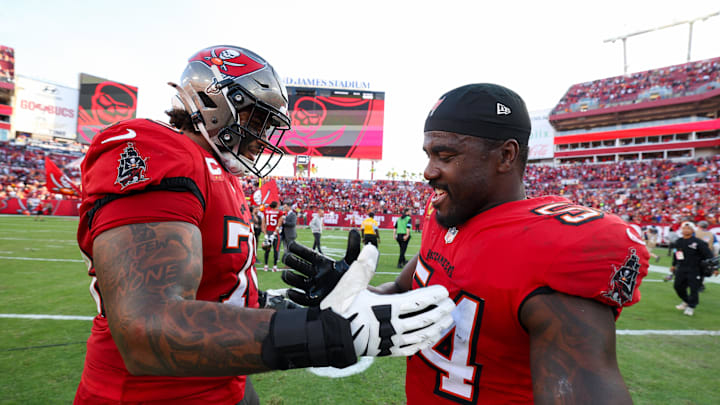Jan 5, 2025; Tampa, Florida, USA; Tampa Bay Buccaneers offensive tackle Tristan Wirfs (78) and linebacker Lavonte David (54) celebrate after beating the New Orleans Saints at Raymond James Stadium. Mandatory Credit: Nathan Ray Seebeck-Imagn Images Jan 5, 2025; Tampa, Florida, USA; Tampa Bay Buccaneers offensive tackle Tristan Wirfs (78) and linebacker Lavonte David (54) celebrate after beating the New Orleans Saints at Raymond James Stadium. Mandatory Credit: Nathan Ray Seebeck-Imagn Images