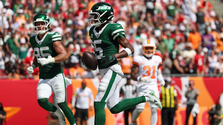 Sep 21, 2025; Tampa, Florida, USA; New York Jets wide receiver Garrett Wilson (5) scores a touchdown against the Tampa Bay Buccaneers in the fourth quarter at Raymond James Stadium. Mandatory Credit: Nathan Ray Seebeck-Imagn Images