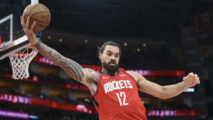 Nov 16, 2025; Houston, Texas, USA; Houston Rockets center Steven Adams (12) grabs a rebound during the first half against the Orlando Magic at Toyota Center. Mandatory Credit: Troy Taormina-Imagn Images Nov 16, 2025; Houston, Texas, USA; Houston Rockets center Steven Adams (12) grabs a rebound during the first half against the Orlando Magic at Toyota Center. Mandatory Credit: Troy Taormina-Imagn Images