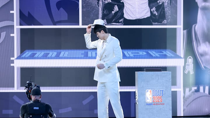 Jun 25, 2025; Brooklyn, NY, USA; Yang Hansen walks on stage after being selected as the 16th pick by the Memphis Grizzlies in the first round of the 2025 NBA Draft at Barclays Center. Mandatory Credit: Brad Penner-Imagn Images Jun 25, 2025; Brooklyn, NY, USA; Yang Hansen walks on stage after being selected as the 16th pick by the Memphis Grizzlies in the first round of the 2025 NBA Draft at Barclays Center. Mandatory Credit: Brad Penner-Imagn Images